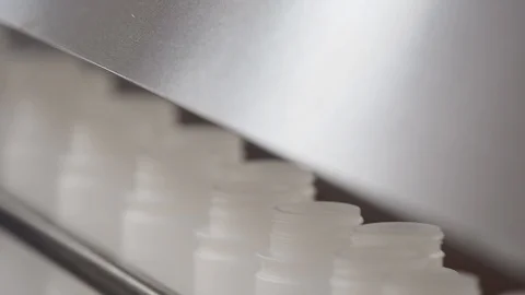 Empty plastic bottles. Traveling on conveyor belt in plant. cu Stock Footage 101975878