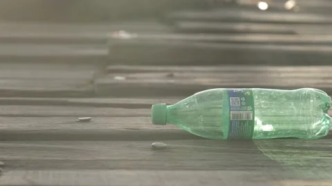Empty plastic bottles on the wood deck Stock Footage 132351819