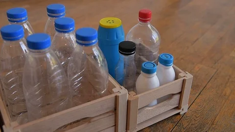 Empty plastic bottles in wooden crates. Sorted empty bottles. Stock Footage 129506265