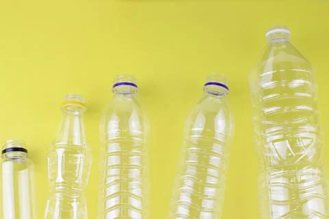 Empty plastic bottom in the line awaiting to be recycled Stock Photos
