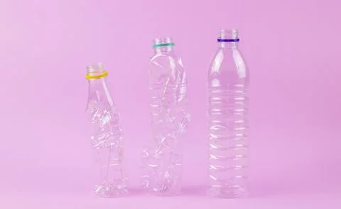 Empty plastic bottom in the line awaiting to be recycled Stock Photos