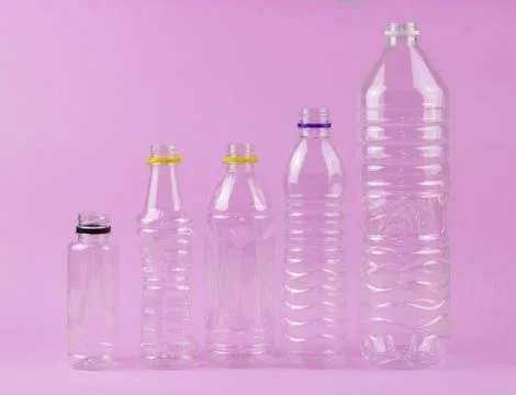 Empty plastic bottom in the line awaiting to be recycled Stock Photos