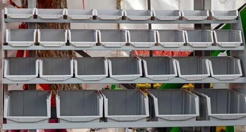 Empty plastic box container crates organizer on a shelf Stock Photos