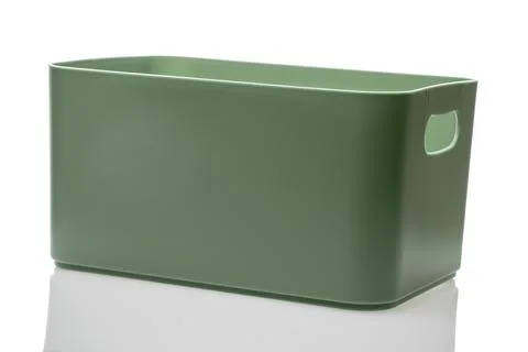 An empty plastic box of green color is isolated on a white background, Stock Photos