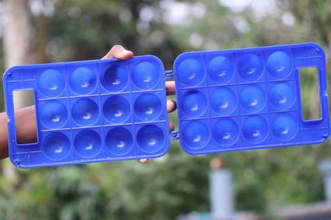 Empty plastic box with slots to keep the eggs held in the hand Stock Photos