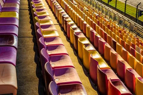 Empty plastic chairs in the stadium. Stock Photos