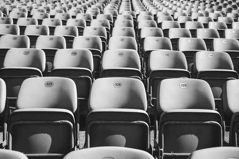 Empty Plastic Chairs at the Stadium Stock Photos