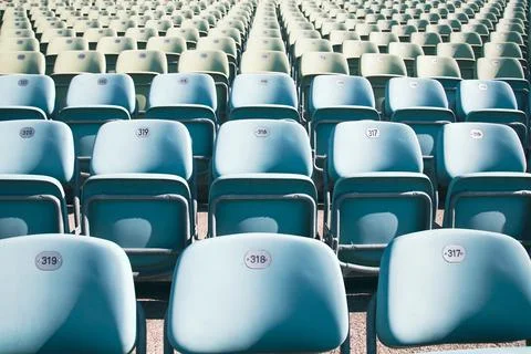 Empty Plastic Chairs at the Stadium Stock Photos