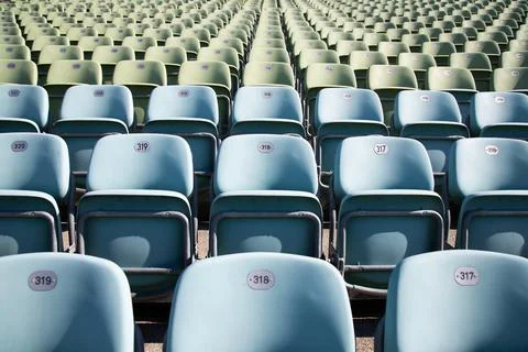Empty Plastic Chairs at the Stadium Stock Photos