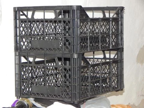 Empty plastic crates in the basement Stock Photos