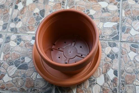 Empty plastic flower pot on terrace ready for planting Stock Photos