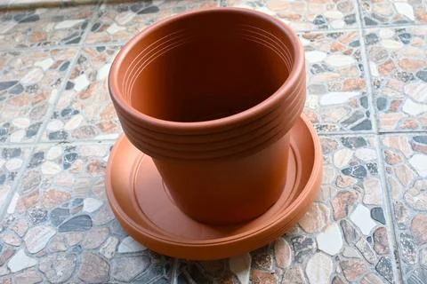 Empty plastic flower pot on terrace ready for planting Stock Photos