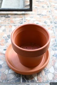 Empty plastic flower pot on terrace ready for planting Photos