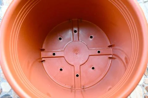 Empty plastic flower pot on terrace ready for planting Stock Photos