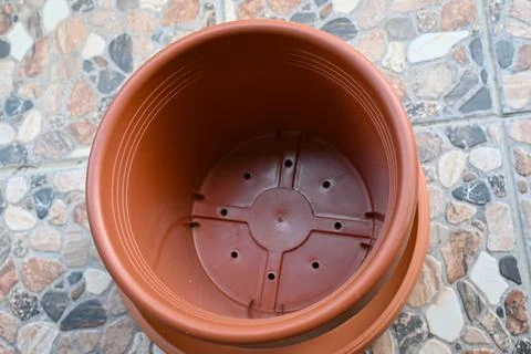 Empty plastic flower pot on terrace ready for planting Photos