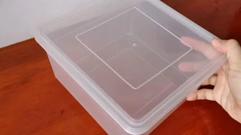 An Empty Plastic Food Container in a Table Stock Footage 231360803