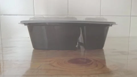 Empty Plastic Food Container on Wooden Table 库存影片 329906109