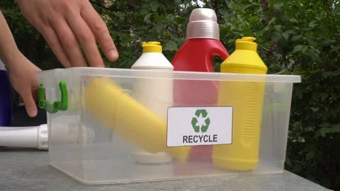 Empty plastic packaging of household chemicals and body care products. Sorting w Stock Footage 122355017