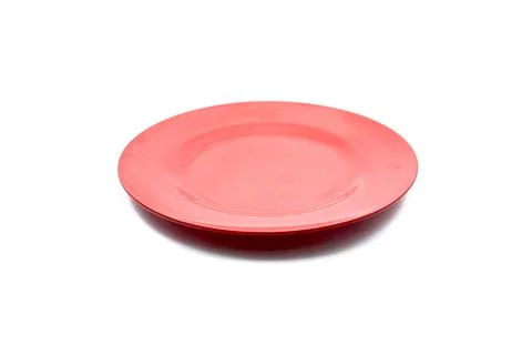 Empty plastic red plate isolated on white background. Stock Photos