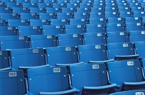 Empty plastic seats in a stadium Stock Photos