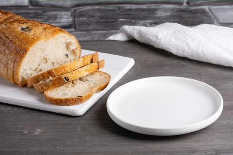 Empty plate and bread on a gray background. Empty copy space Stock Photos