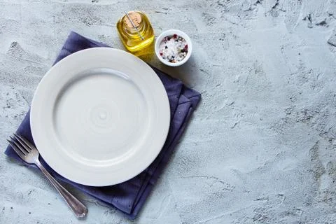 Empty plate and fork Stock Photos