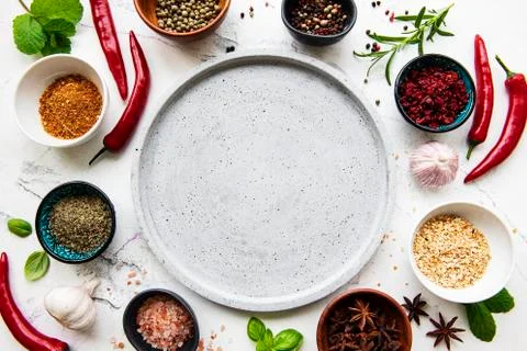 Empty plate and frame of spices Stock Photos