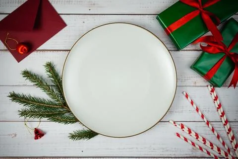 Empty plate with christmas decorations and fir tree on Stock Photos