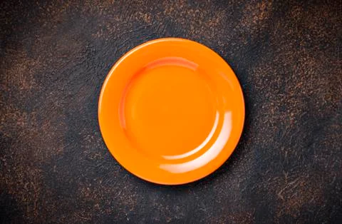Empty plate on concrete table Stock Photos