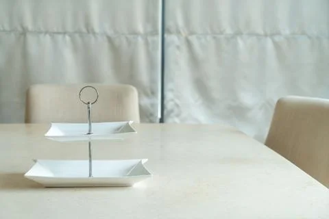 Empty plate on dining table Stock Photos