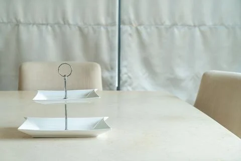 Empty plate on dining table Stock Photos