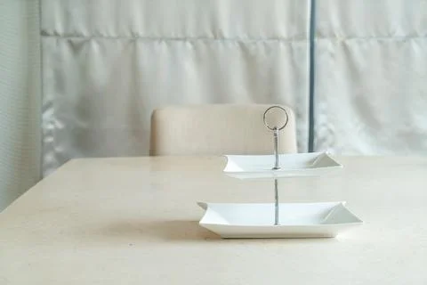 Empty plate on dining table Stock Photos