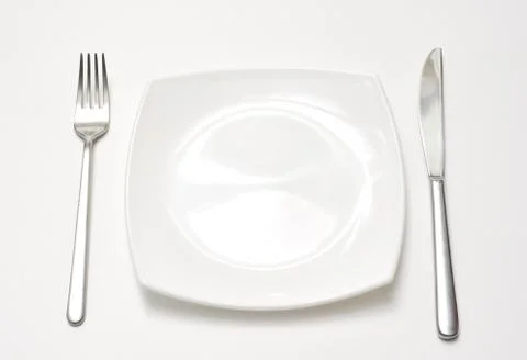 Empty plate with fork and knife 写真素材