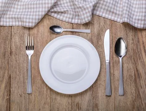 Empty plate with fork and knife Stock Photos