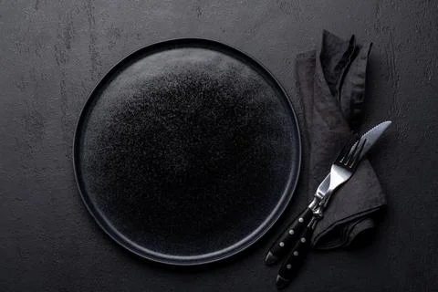Empty plate with fork and knife Stock Photos