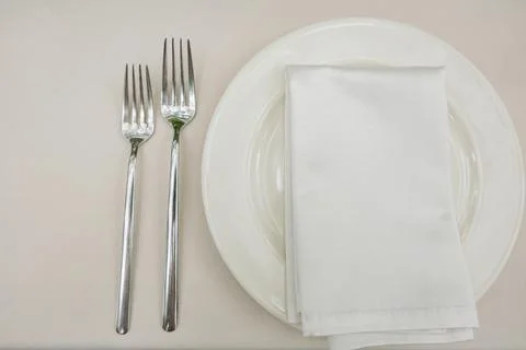 Empty plate with fork on old white table, Top view Stock Photos