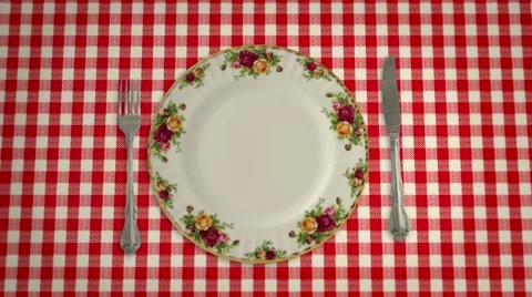 Empty Plate Knife and Fork on a Table Cloth in Stop Motion Stock Footage 66006887