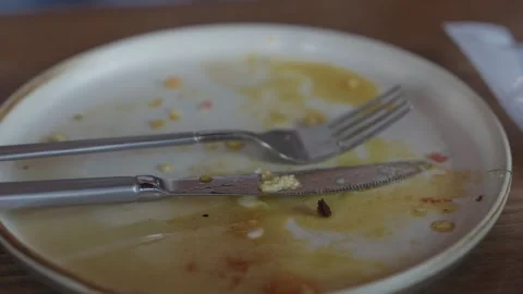 Empty Plate with Knife and Fork After Finished Meal Close Up 스톡 동영상 343988018