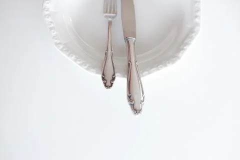 Empty plate with knife and fork , beautiful cutlery Stock Photos