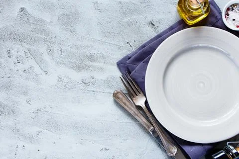 Empty plate, knife and fork Stock Photos