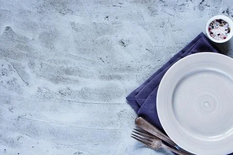 Empty plate, knife and fork Stock Photos