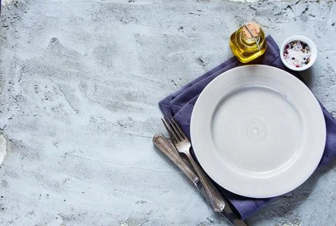 Empty plate, knife and fork Stock Photos