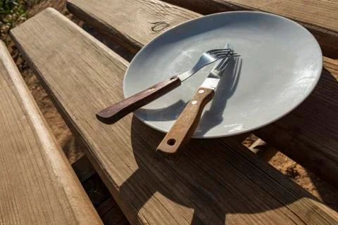Empty plate with knife and fork Stock Photos