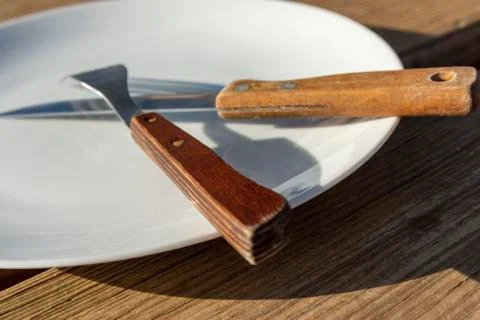 Empty plate with knife and fork Stock Photos