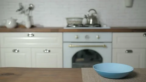 Empty plate on modern kitchen background Stock Footage 168676659