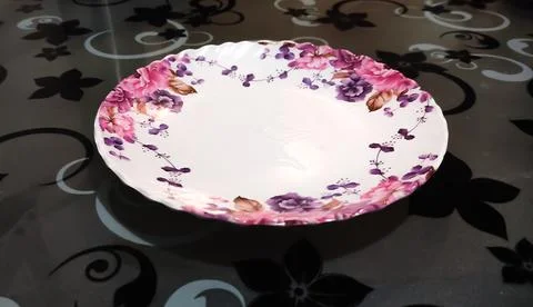 Empty plate placed on a table Stock Photos