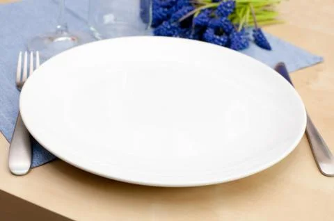 Empty plate in restaurant Stock Photos