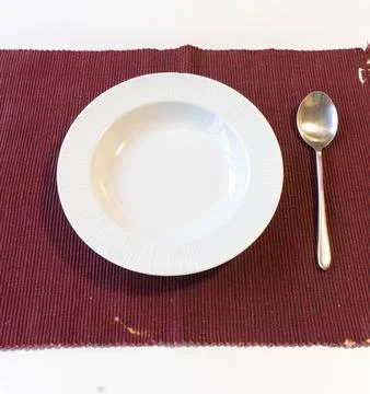 Empty plate with spoon Stock Photos