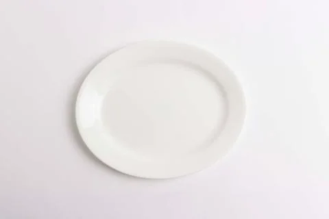 Empty plate on white background Stock Photos