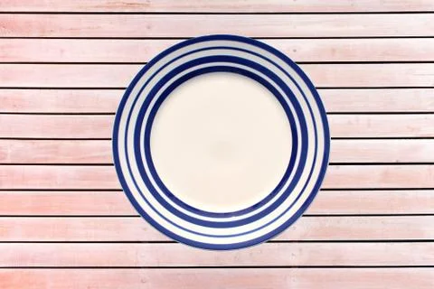 Empty plate on wood background Stock Photos
